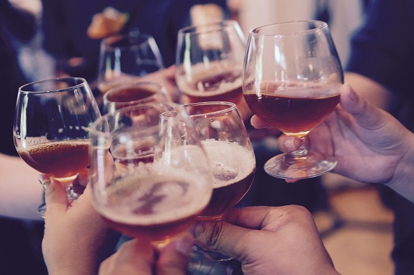 A group of people holding wine glasses Description automatically generated with medium confidence 